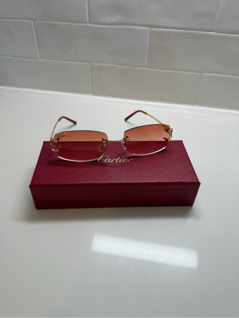 Cartier Rimless Sunglasses with Pink Gradient Lenses and Gold Temples